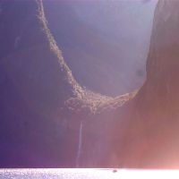 Milford Sound with very tiny boat